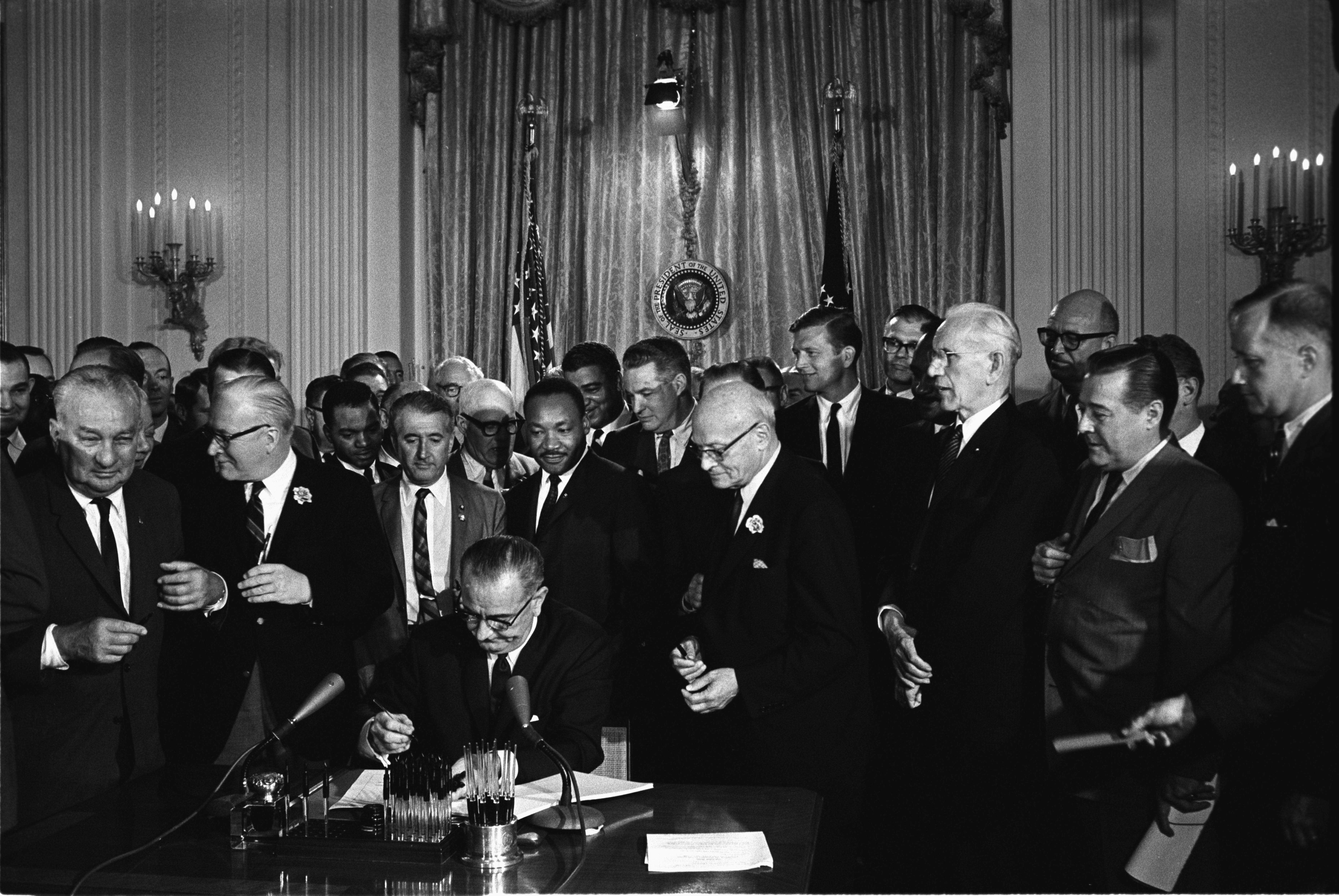 Lyndon_Johnson_signing_Civil_Rights_Act_July_2_1964