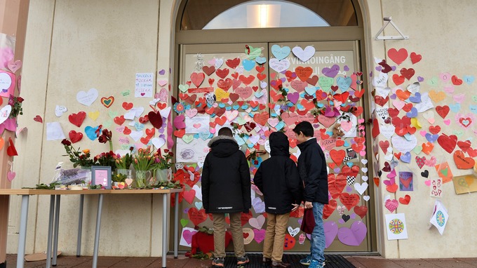 Community members "love bomb" a mosque in Sweden. Photo Credit: Reuters