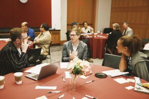 Andreas Psota speaks with Summit attendees